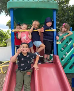 Children playing on the playground slide