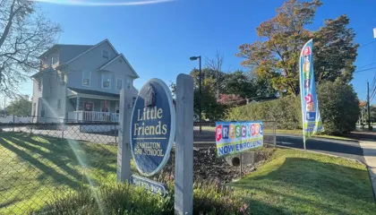 The Little Friends School sign on Edinburg Road on a sunny day